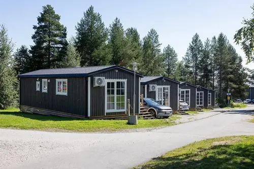 Five grey cabins. 